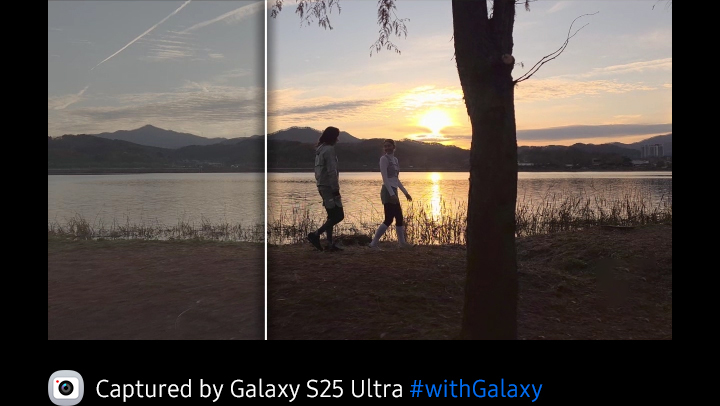 Galaxy S25 Ultra main screen shows two subjects walking by a lake while being shot in Log video mode. The footage in shooting mode is shown in low contrast and when professional colour grading is applied, a more dynamic range of colour and contrast is seen.