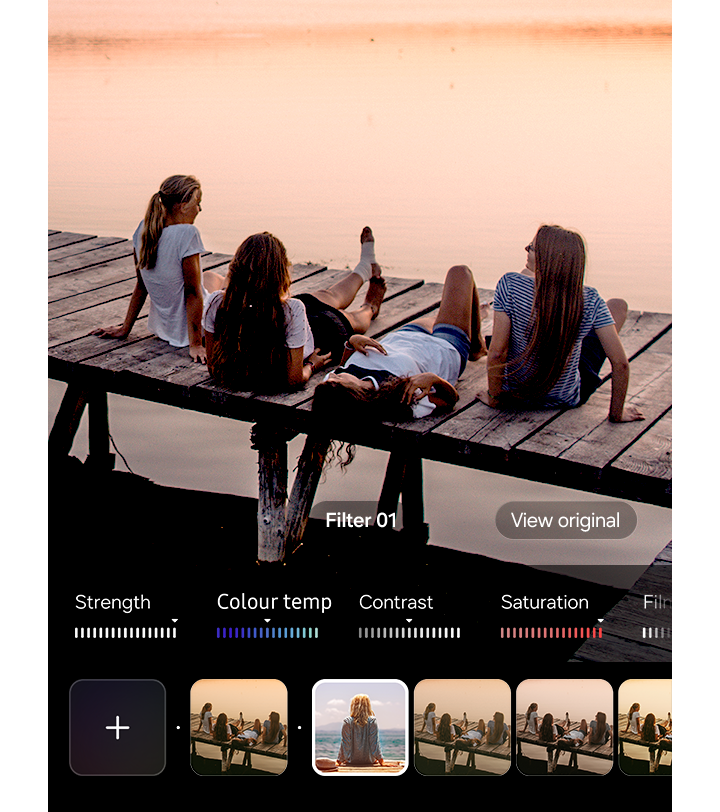 Picture of friends on a dock is being shot with a filter applied. Various custom filters can be applied while shooting.