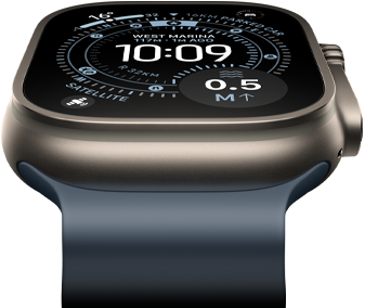 Apple Watch Ultra 3 tilted forward, natural titanium case, compass on Orienteering watch face, anchor blue Ocean Band