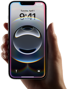 A hand holds iPhone 16e, a light, colourful glow along the edge of an all-screen display